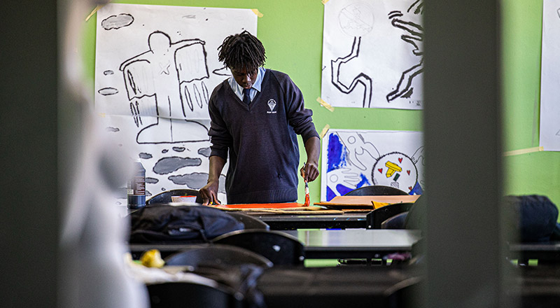 Art student from Delany Catholic College Granville painting and using the available facilities and resources